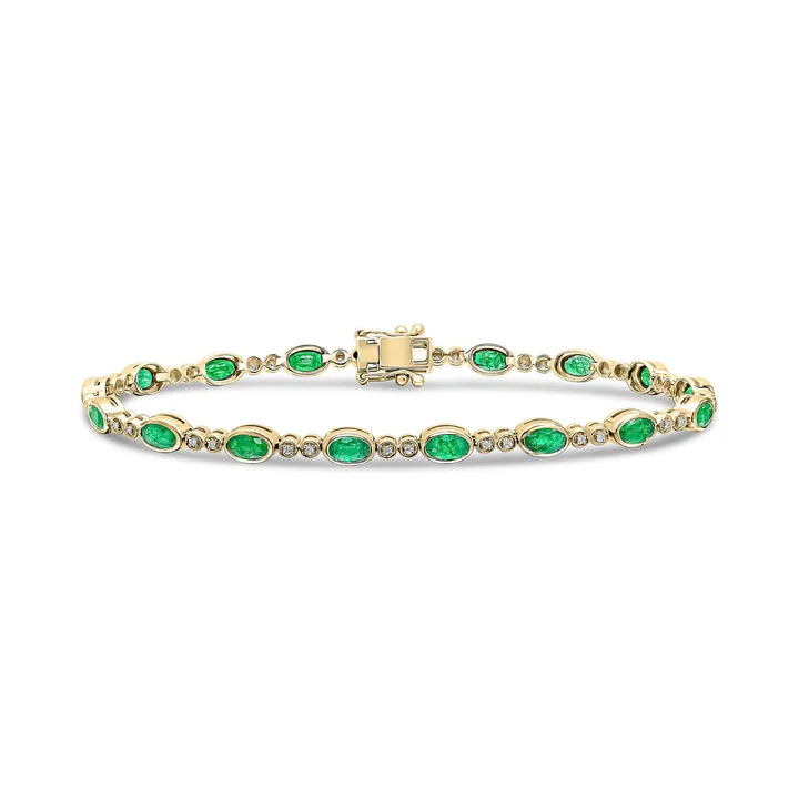 ladies bracelets rope textures -18ct Gold yellow and white gold oval emerald and brilliant cut diamond bracelet