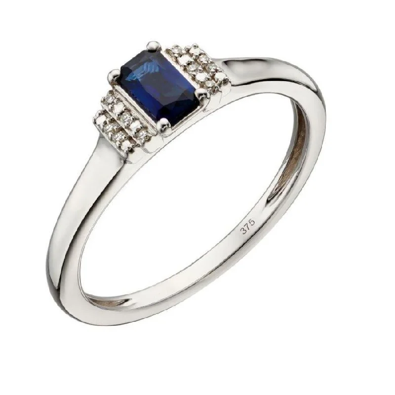 Ladies broad gleam rings -9ct White Gold Emerald Cut Sapphire & Stepped Diamond Shoulders Ring