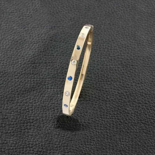 ladies gold bracelets wave patterns -Sapphire & Diamond Bangle