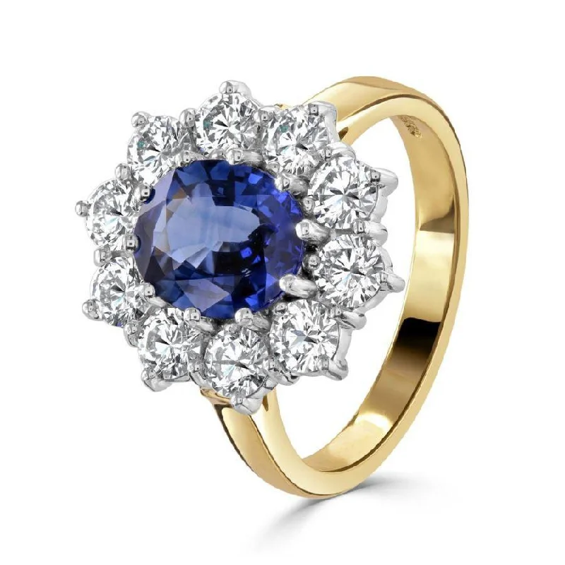 Ladies glint charm rings -18ct Yellow Gold Oval Cut Sapphire & Round Brilliant Cut Diamond Cluster Ring