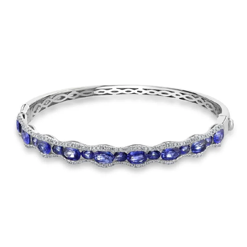 ladies gold bracelets dog motifs -18ct White Gold Oval Cut Sapphire & Diamond Wave Hinged Bangle