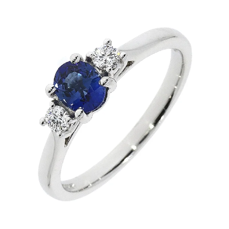 Ladies relic charm rings -18ct white gold claw set oval cut Sapphire and 2 brilliant cut Diamond ring