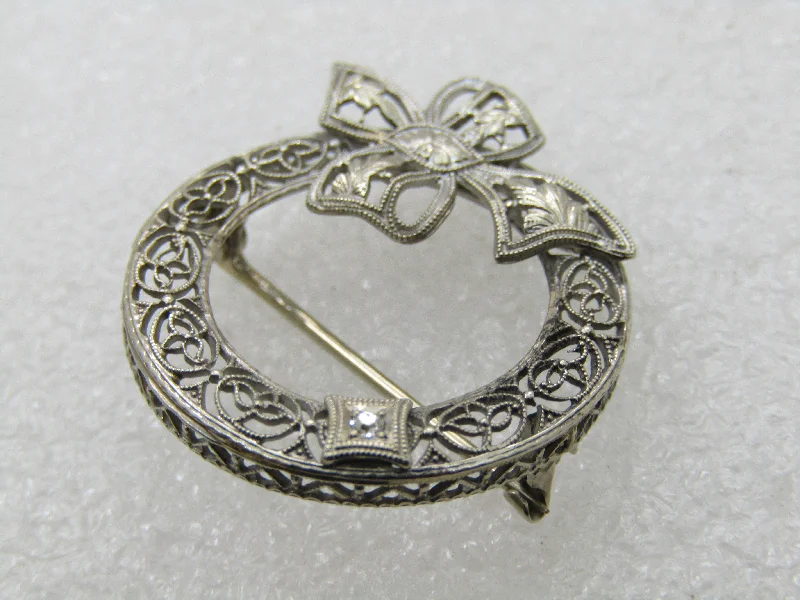 polished gold brooch for women -Early 1900's 14kt Filigree Diamond Brooch, Circle with Bow, 1"