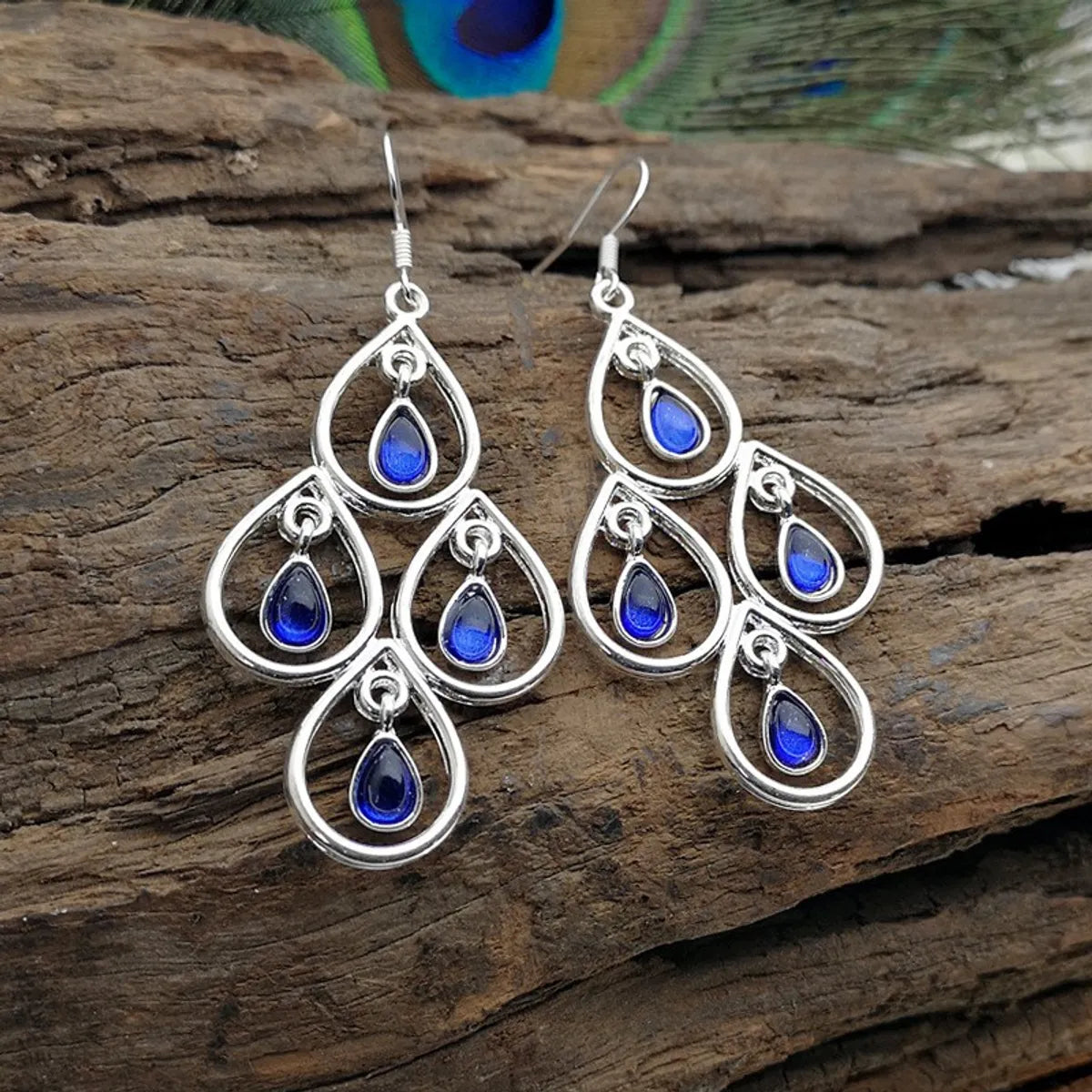 Shining silver earrings -Creative Peacock Blue Moonstone Drop-Shaped Hollow Pendant Earrings